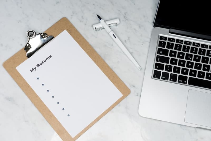 ResumeAI interface showing generated resume content alongside a live applicant tracking system compatibility score